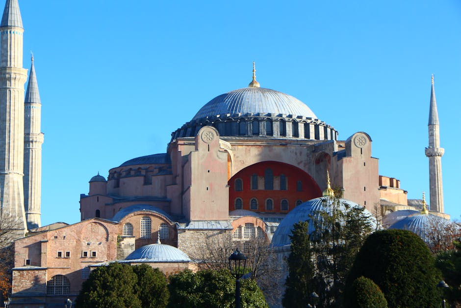 Beautiful view of Hagia Sophia Grand Mosque in Istanbul under a vibrant blue sky.