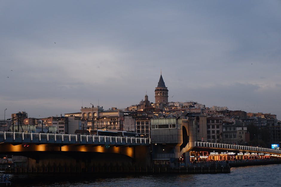 Scenic view of Galata Tower and Bridge during twilight in Istanbul, Turkey.
