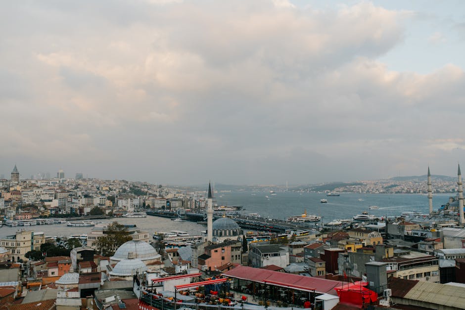Explore Istanbul's stunning skyline with iconic mosques and the bustling Bosphorus, captured in a magnificent aerial shot.
