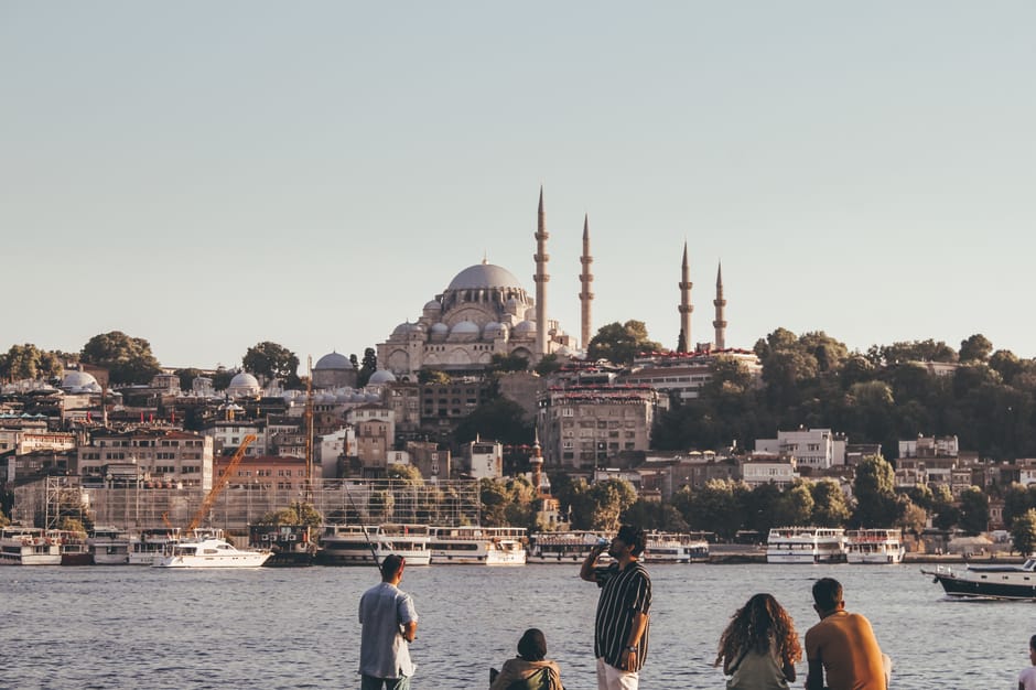A stunning cityscape of Istanbul featuring the iconic Suleymaniye Mosque and bustling waterfront.