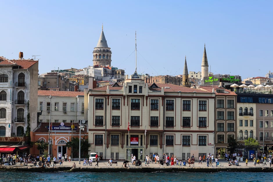 Breathtaking view of the Galata Tower in Istanbul, surrounded by historic architecture and vibrant city life.