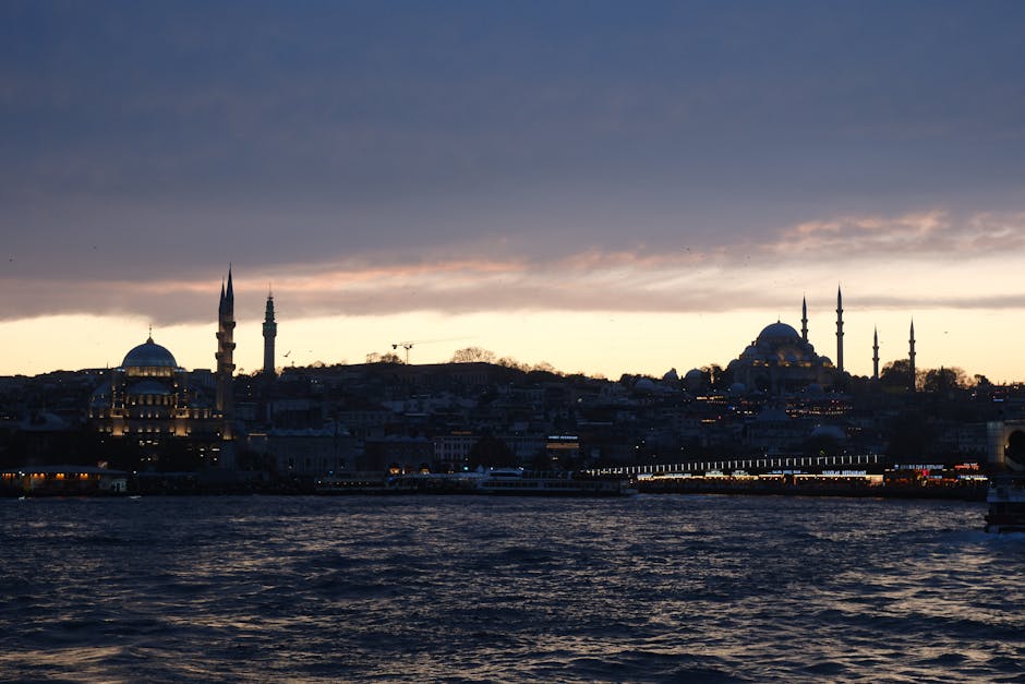 A stunning view of Istanbul's skyline at sunset, featuring iconic mosques silhouetted against the sky.